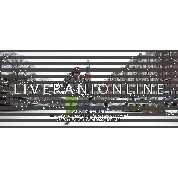 (120209) AMSTERDAM, Feb. 9, 2012() People skate on the frozen canal in Amsterdam, the Netherlands, on Feb. 8, 2012. The cold snap in Europe has frozen most of the canals in Amsterdam. Amsterdam has more than 100 canals and 1,000 bridges, making \'a city of canals\'. (/Robin Utrecht) (zf) /AG ALDO LIVERANI SAS - ITALY ONLY