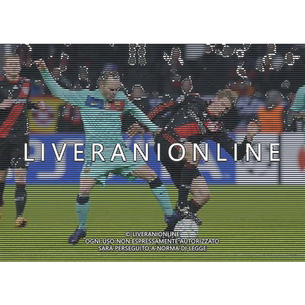 (120215) -- LEVERKUSEN, Feb. 15, 2012 () -- -- Andres Iniesta (L) of Barcelona vies with Lars Bender of Leverkusen during first round of 1/8 final of Champions League football match between Bayer Leverkusen and FC Barcelona in Leverkusen, Germany, February 14, 2012. FC Barcelona won 3:1. (/Uwe Kraft) - Xinhua/Photoshot - ag. aldo liverani sas italy only GERMANIA - CALCIO: OTTAVI DI FINALE CHAMPIONS LEAGUE. PARTITA: BAYER LEVERKUSEN vs BARCELLONA