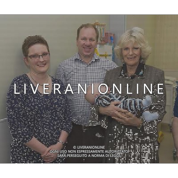 The Duchess of Cornwall opened the new Dyson Centre for Neonatal Intensive Care, (NICU) Royal United Hospital Bath NHS Trust, Combe Park, Bath BTHE DUCHESS HOLD NATHAN COSH WITH HER IS MOTHER KATE STOBIE AND FATHER STEVE COSH ©