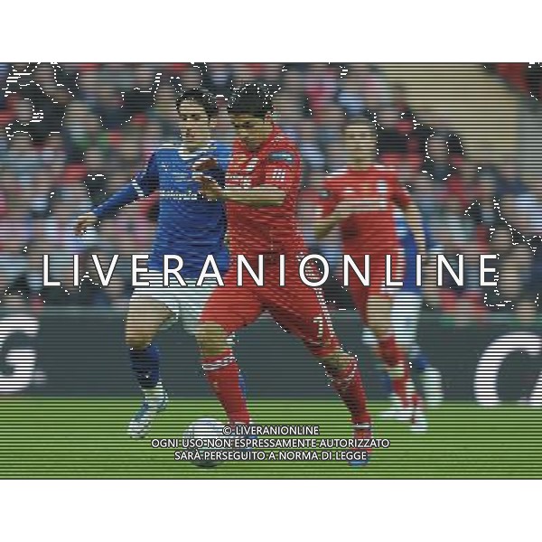 Liverpool\'s Luis Suarez battles with Cardiff City\'s Peter Whittingham Football - Carling Cup Final - Cardiff City v Liverpool - Sunday 26 February 2012 - Wembley Stadium - London å© CameraSport - 43 Linden Ave. Countesthorpe. Leicester. England. LE8 5PG - Tel: +44 (0) 116 277 4147 - admin@camerasport.com - www.camerasport.com AG ALDO LIVERANI S A S ONLY ITALY