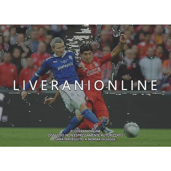 Liverpool\'s Luis Suarez is tackled by Cardiff City\'s Kevin McNaughton Football - Carling Cup Final - Cardiff City v Liverpool - Sunday 26 February 2012 - Wembley Stadium - London å© CameraSport - 43 Linden Ave. Countesthorpe. Leicester. England. LE8 5PG - Tel: +44 (0) 116 277 4147 - admin@camerasport.com - www.camerasport.com AG ALDO LIVERANI S A S ONLY ITALY