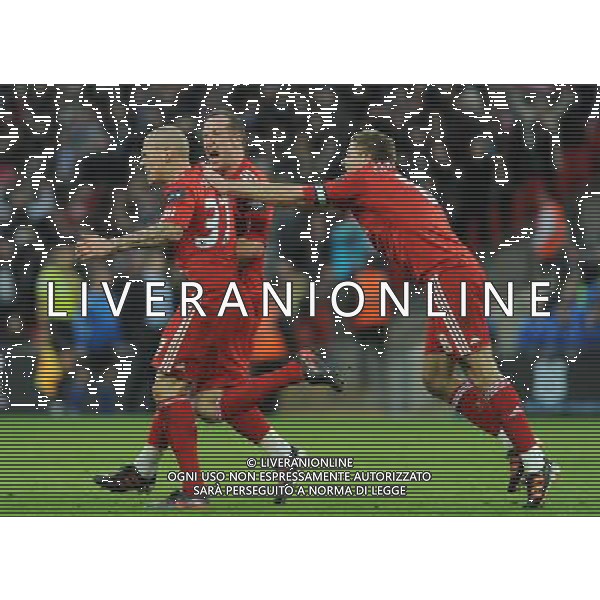 Liverpool\'s Martin Skrtel celebrates scoring his sides equalising goal to make the score with team-mate Steven Gerrard and Charlie Adam Football - Carling Cup Final - Cardiff City v Liverpool - Sunday 26 February 2012 - Wembley Stadium - London å© CameraSport - 43 Linden Ave. Countesthorpe. Leicester. England. LE8 5PG - Tel: +44 (0) 116 277 4147 - admin@camerasport.com - www.camerasport.com AG ALDO LIVERANI S A S ONLY ITALY