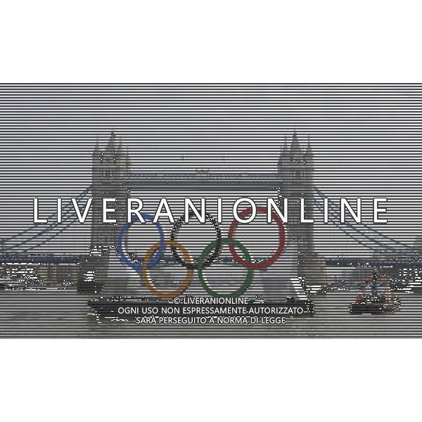 In front of the historic Tower Bridge, a giant Olympic Rings floats on the River Thames in London in the run-up for the Olympic games, during its launch to mark 150-days until the start of the London 2012 Olympic games, Tuesday, Feb. 28, 2012 /PHOTOSHOT/AG ALDO LIVERANI SAS - ITALY ONLY -