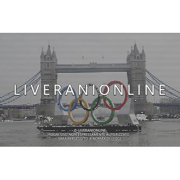 In front of the historic Tower Bridge, a giant Olympic Rings floats on the River Thames in London in the run-up for the Olympic games, during its launch to mark 150-days until the start of the London 2012 Olympic games, Tuesday, Feb. 28, 2012 /PHOTOSHOT/AG ALDO LIVERANI SAS - ITALY ONLY -