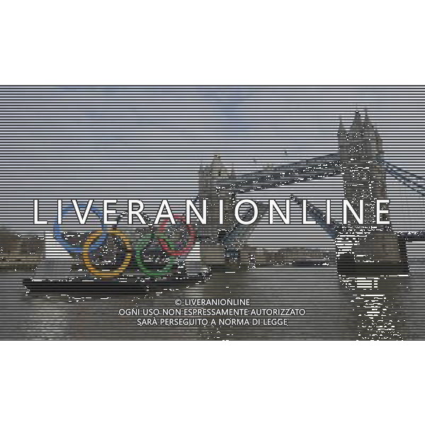 In front of the historic Tower Bridge, a giant Olympic Rings floats on the River Thames in London in the run-up for the Olympic games, during its launch to mark 150-days until the start of the London 2012 Olympic games, Tuesday, Feb. 28, 2012 /PHOTOSHOT/AG ALDO LIVERANI SAS - ITALY ONLY -