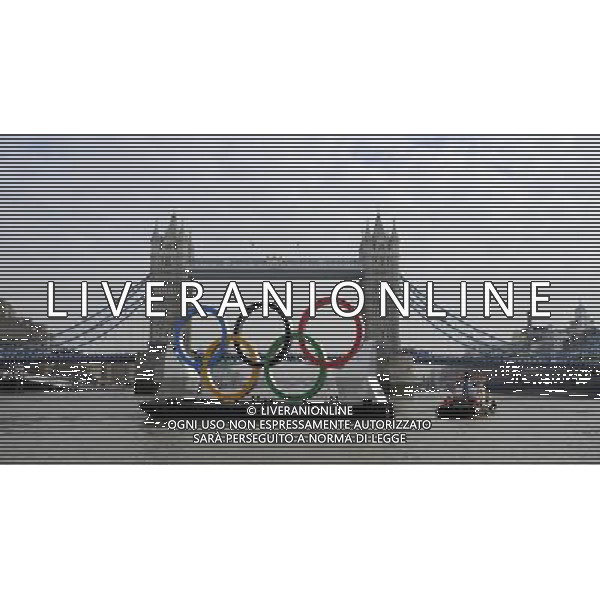 In front of the historic Tower Bridge, a giant Olympic Rings floats on the River Thames in London in the run-up for the Olympic games, during its launch to mark 150-days until the start of the London 2012 Olympic games, Tuesday, Feb. 28, 2012 /PHOTOSHOT/AG ALDO LIVERANI SAS - ITALY ONLY -
