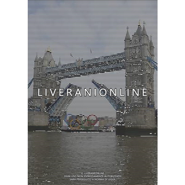 In front of the historic Tower Bridge, a giant Olympic Rings floats on the River Thames in London in the run-up for the Olympic games, during its launch to mark 150-days until the start of the London 2012 Olympic games, Tuesday, Feb. 28, 2012 /PHOTOSHOT/AG ALDO LIVERANI SAS - ITALY ONLY -