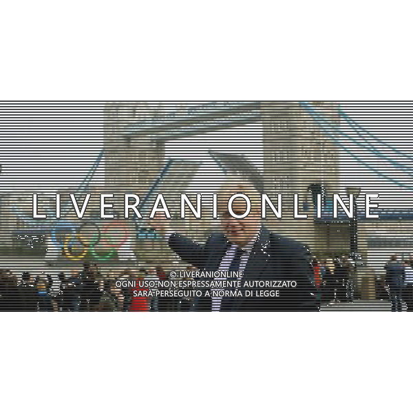 Mayor Boris Johnson watches the 11ft Olympic Rings go down the Thames and under Tower Bridge by City Hall today 28th February 2012 to let the general public know that there is only 150 days left until the Olympic Games begin in London, picture by Marc Larkin/ /PHOTOSHOT/AG ALDO LIVERANI SAS - ITALY ONLY -