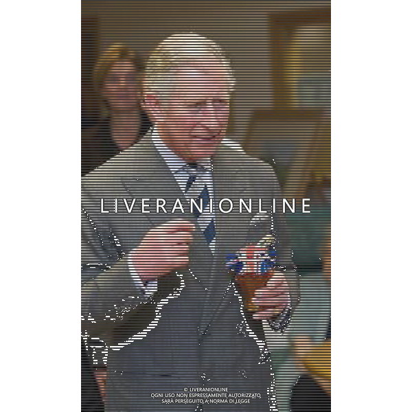 The Prince of Wales visits Priscilla Bacon Lodge in Norwich today (Mon) and is presented with some home made marmalade on 26th February 2012. /PHOTOSHOT/ALDO LIVERANI SAS - ITALY ONLY -