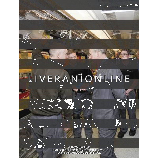 The Prince of Wales visited Bombardier Transportation, he toured the facility and met members of the workforce, and then drove a London Underground tube train built for the Metropolitan line at their factory in Derby. THE PRINCE WATCHES A TUBE TRAIN BEING BUILT AND CHATS WITH ELECTRICIANS DAVID MOSS LEFT AND LAURENCE ROSTRON.... H ©photoshot/AGENZIA ALDO LIVERANI SAS - ITALY ONLY - REALI INGLESI: Il Principe Carlo d\'inghilterra in visita al Bombardier Transportation, ha visitato la struttura e incontrato i membri della forza lavoro, e poi guidato un treno per la metropolitana di Londra costruito presso lo stabilimento di Derby.