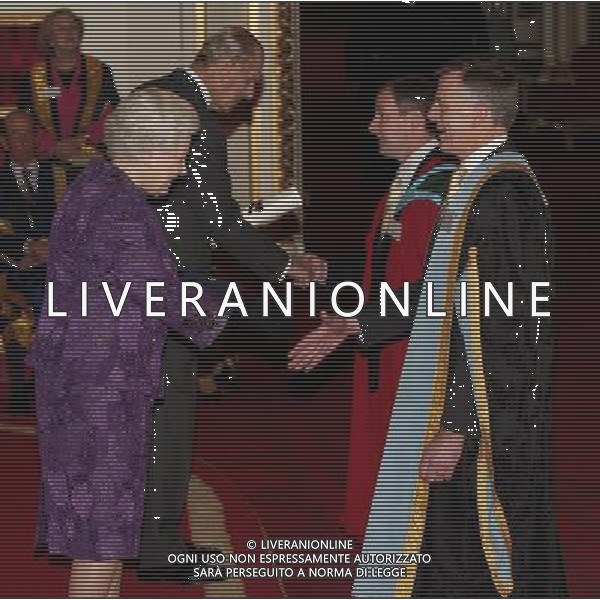 Queen Elizabeth II and The Duke of Edinburgh present a Royal Anniversary Prize for Higher and Further Education to Professor Sir Peter Gregson (right) and Professor Dennis McCance of Queen\'s University Belfast, at Buckingham Palace, central London. The honour recognises and celebrates outstanding work which is making a practical impact for human progress. ©photoshot/AGENZIA ALDO LIVERANI SAS - ITALY ONLY - REALI INGLESI: La regina Elisabetta II d\'inghilterra, durante il ricevimento della consegna dei premi dei Royal Anniversary Prizes a Buckingham Palace, a Londra.