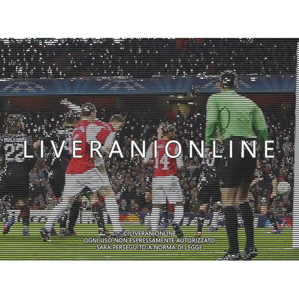 Arsenal\'s Laurent Koscielny scores his sides first goal 1-0 Football - UEFA Champions League Group F - Arsenal v AC Milan - Tue 06 Mar 2012 - Emirates Stadium - London © CameraSport - 43 Linden Ave. Countesthorpe. Leicester. England. LE8 5PG - Tel: +44 (0) 116 277 4147 - admin@camerasport.com - www.camerasport.com AG ALDO LIVERANI S A S ONLY ITALY