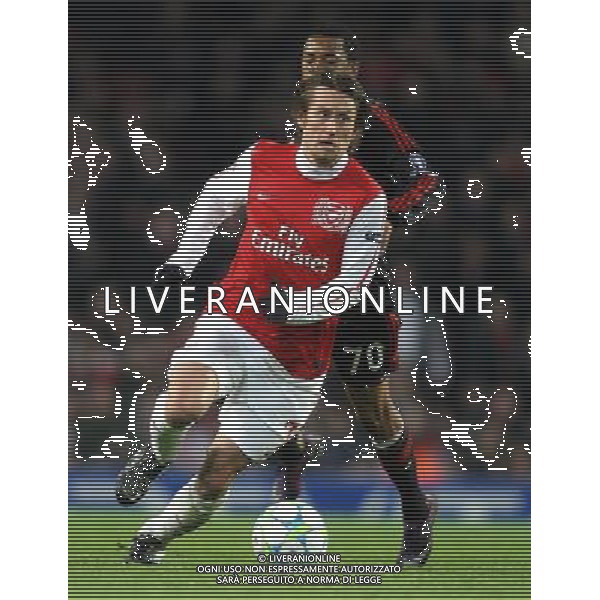 Arsenal\'s Tomas Rosicky shields the ball from AC Milan\'s Robinho Football - UEFA Champions League Group F - Arsenal v AC Milan - Tue 06 Mar 2012 - Emirates Stadium - London © CameraSport - 43 Linden Ave. Countesthorpe. Leicester. England. LE8 5PG - Tel: +44 (0) 116 277 4147 - admin@camerasport.com - www.camerasport.com AG ALDO LIVERANI S A S ONLY ITALY