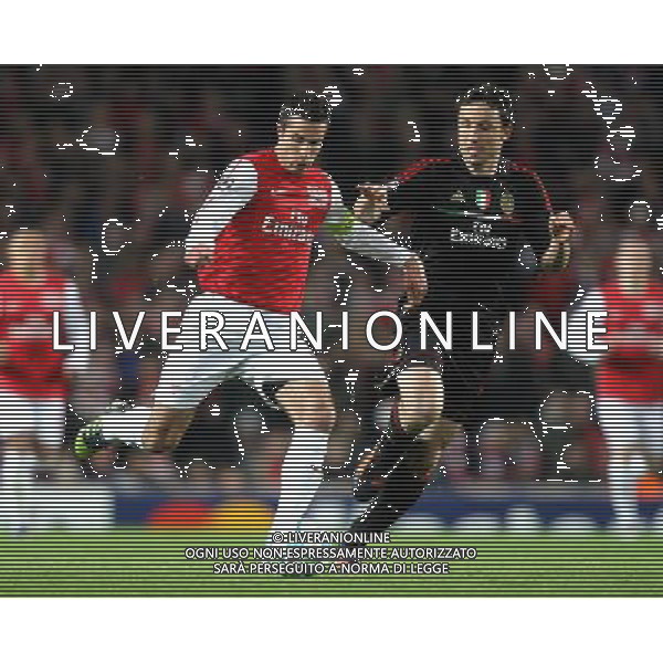 Arsenal\'s Robin van Persie battles with AC Milan\'s Mark van Bommel Football - UEFA Champions League Group F - Arsenal v AC Milan - Tue 06 Mar 2012 - Emirates Stadium - London © CameraSport - 43 Linden Ave. Countesthorpe. Leicester. England. LE8 5PG - Tel: +44 (0) 116 277 4147 - admin@camerasport.com - www.camerasport.com AG ALDO LIVERANI S A S ONLY ITALY