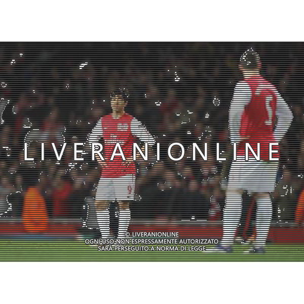 Arsenal\'s Park Chu-Young and Arsenal\'s Thomas Vermaelen show their dejection at the end of the match Football - UEFA Champions League Group F - Arsenal v AC Milan - Tue 06 Mar 2012 - Emirates Stadium - London © CameraSport - 43 Linden Ave. Countesthorpe. Leicester. England. LE8 5PG - Tel: +44 (0) 116 277 4147 - admin@camerasport.com - www.camerasport.com AG ALDO LIVERANI S A S ONLY ITALY