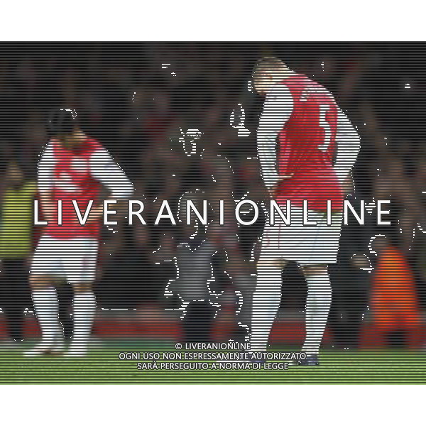 Arsenal\'s Park Chu-Young and Arsenal\'s Thomas Vermaelen show their dejection at the end of the match Football - UEFA Champions League Group F - Arsenal v AC Milan - Tue 06 Mar 2012 - Emirates Stadium - London © CameraSport - 43 Linden Ave. Countesthorpe. Leicester. England. LE8 5PG - Tel: +44 (0) 116 277 4147 - admin@camerasport.com - www.camerasport.com AG ALDO LIVERANI S A S ONLY ITALY