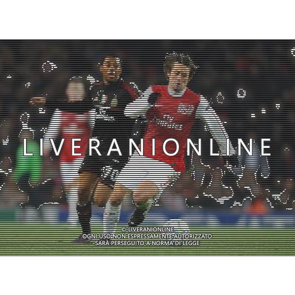Arsenal\'s Tomas Rosicky shields the ball from AC Milan\'s Robinho Football - UEFA Champions League Group F - Arsenal v AC Milan - Tue 06 Mar 2012 - Emirates Stadium - London © CameraSport - 43 Linden Ave. Countesthorpe. Leicester. England. LE8 5PG - Tel: +44 (0) 116 277 4147 - admin@camerasport.com - www.camerasport.com AG ALDO LIVERANI S A S ONLY ITALY
