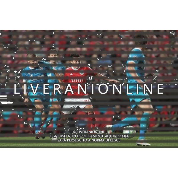 20120306: LISBON, PORTUGAL - Champions League 2011/2012 - 2st leg: SL Benfica vs Zenit FC. In picture: Benfica\'s midfielder Nicolas Gaitan tries to escape Zenit\'s defender Aleksandr Anyukov. PHOTO: Carlos Rodrigues/CITYFILES pilka nozna liga mistrzow sezon 2011/2012 BENFICA LIZBONA vs ZENIT SANKT PETERSBURG FOT. CITYFILES/NEWSPIX.PL PORTUGAL,BRAZIL,SPAIN,GERMANY,FRANCE,UK OUT !!! --- Newspix.pl /AG ALDO LIVERANI SAS ITALY ONLY *** Local Caption *** .