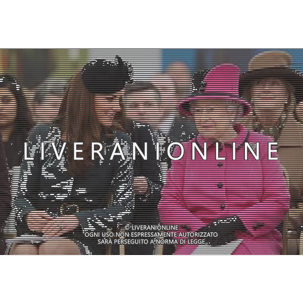 LEICESTER, ENGLAND - MARCH 08: Queen Elizabeth II (R) and Catherine, Duchess of Cambridge (L) watch a fashion show at De Montfort University on March 8, 2012 in Leicester, England. The royal visit to Leicester marks the first date of Queen Elizabeth II\'s Diamond Jubilee tour of the UK between March 8 and July 25, 2012. ©photoshot/AGENZIA ALDO LIVERANI SAS - ITALY ONLY - REALI INGLESI: La Regina Elisabetta II d\'inghilterra accompagnata dal Duca di Edimburgo e da Kate Middleton Duchessa di Cambridge in visita a Leicester, 8 marzo 2012.