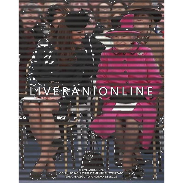 LEICESTER, ENGLAND - MARCH 08: Queen Elizabeth II (R) and Catherine, Duchess of Cambridge (L) watch a fashion show at De Montfort University on March 8, 2012 in Leicester, England. The royal visit to Leicester marks the first date of Queen Elizabeth II\'s Diamond Jubilee tour of the UK between March 8 and July 25, 2012. ©photoshot/AGENZIA ALDO LIVERANI SAS - ITALY ONLY - REALI INGLESI: La Regina Elisabetta II d\'inghilterra accompagnata dal Duca di Edimburgo e da Kate Middleton Duchessa di Cambridge in visita a Leicester, 8 marzo 2012.