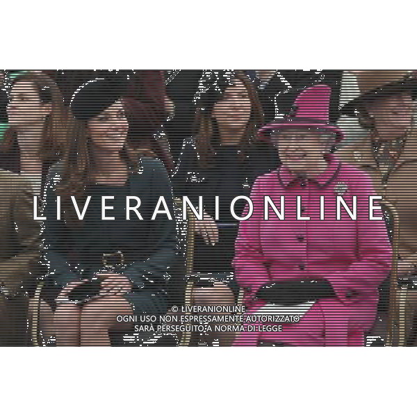 LEICESTER, ENGLAND - MARCH 08: Queen Elizabeth II (R) and Catherine, Duchess of Cambridge (L) watch a fashion show at De Montfort University on March 8, 2012 in Leicester, England. The royal visit to Leicester marks the first date of Queen Elizabeth II\'s Diamond Jubilee tour of the UK between March 8 and July 25, 2012. ©photoshot/AGENZIA ALDO LIVERANI SAS - ITALY ONLY - REALI INGLESI: La Regina Elisabetta II d\'inghilterra accompagnata dal Duca di Edimburgo e da Kate Middleton Duchessa di Cambridge in visita a Leicester, 8 marzo 2012.