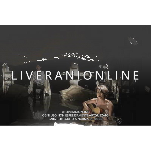 (120309) -- BEIJING, March 9, 2012 () -- Actor Liu Chang (Back) plays Ma Lu, a rhinoceros feeder who is in love with Ming Ming, played by actress Huang Xiangli (Front), during the latest production of \'Rhinoceros In Love\', an experimental play directed by Meng Jinghui, at Beehive Theater in Beijing, capital of China, March 8, 2012. \'Rhinoceros In Love\' tells the story of a rhinoceros feeder who falls in love with a beautiful woman. About 900 performances of the play have been staged in 36 cities worldwide since its debut in summer 1999. (/Jin Liangkuai) (lmm) ©photoshot/AGENZIA ALDO LIVERANI SAS - ITALY ONLY - Attori e attrici teatrali eseguire durante l\'ultima produzione di \'rinoceronte in amore\', un rappresentazione sperimentale diretto da Meng Jinghui, al Teatro Beehive a Pechino, capitale della Cina, 8 marzo 2012.