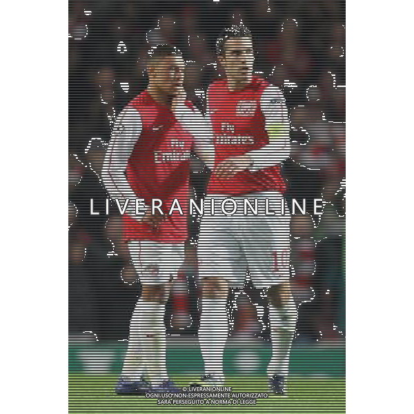 Arsenal\'s Robin van Persie celebrates scoring his sides third goal 3-0 with Arsenal\'s Alex Oxlade-Chamberlain Football - UEFA Champions League Group F - Arsenal v AC Milan - Tue 06 Mar 2012 - Emirates Stadium - London © CameraSport - 43 Linden Ave. Countesthorpe. Leicester. England. LE8 5PG - Tel: +44 (0) 116 277 4147 - admin@camerasport.com - www.camerasport.com AG ALDO LIVERANI S A S ONLY ITALY
