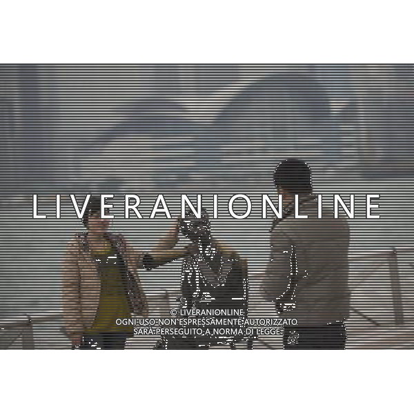 (120314) -- HONG KONG, March 14, 2012 () -- Tourists pose for photos at the Avenue of Stars in Hong Kong, south China, March 14, 2012. Hong Kong\'s visitor arrivals in package tours in February soared by 37.7 percent year on year to 9,204, and the total visitor arrivals in package tours in January and February add up to 17,761, according to figures released by the Travel Industry of Hong Kong Wednesday. (/Liu Sui Wai)(zkr)