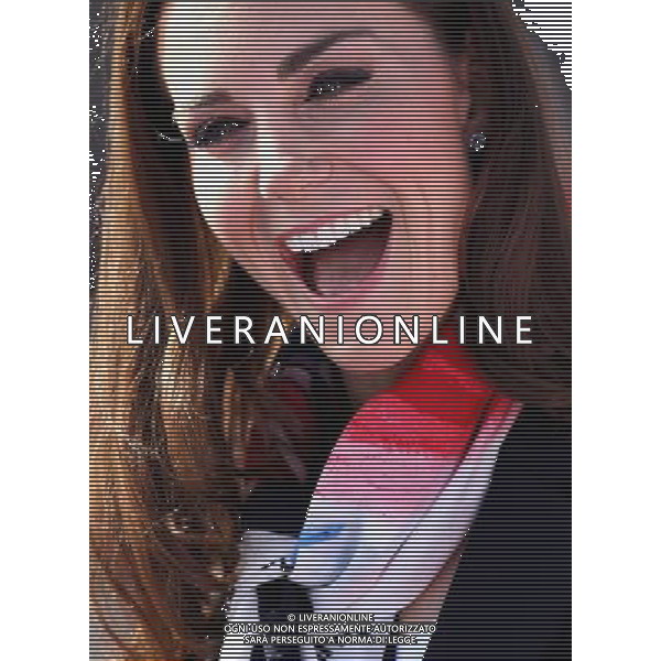 LONDON, ENGLAND - MARCH 15: Catherine, Duchess of Cambridge smiles as she wears the Team GB Official Supporter\'s Scarf for London 2012 before meeting the GB HockeyTeam at the Riverside Arena in the Olympic Park on March 15, 2012 in London, England. The Duchess of Cambridge viewed the Olympic park as well as meeting members of the men\'s and women\'s GB Hockey teams. ©photoshot/AGENZIA ALDO LIVERANI SAS - ITALY ONLY - REALI INGLESI: Kate Middleton, duchessa di Cambridge in visita al Parco Olimpico presso l\'Arena Riverside per incontrare i membri degli uomini e donne della squadra di hockey inglese - Londra, Inghilterra - 15 marzo 2012