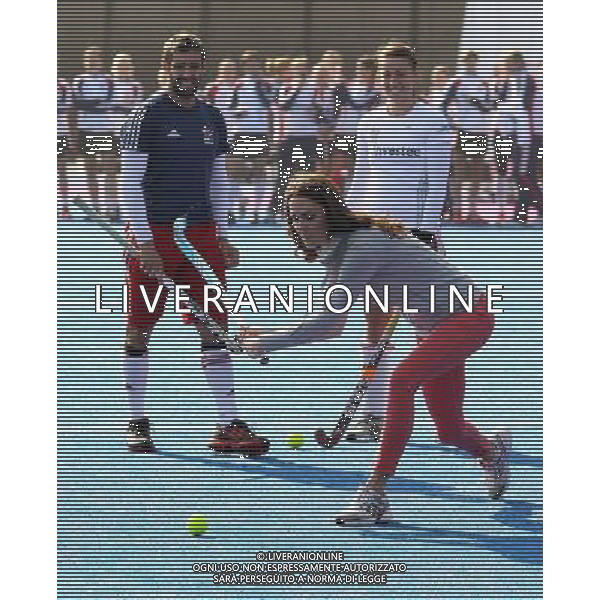 LONDON, ENGLAND - MARCH 15: Women\'s Team GB hockey captain Kate Walsh and men\'s team player Niall Stott watches Catherine, Duchess of Cambridge play hockey with the GB hockey teams at the Riverside Arena in the Olympic Park on March 15, 2012 in London, England. The Duchess of Cambridge viewed the Olympic park as well as meeting members of the men\'s and women\'s GB Hockey teams. ©photoshot/AGENZIA ALDO LIVERANI SAS - ITALY ONLY - REALI INGLESI: Kate Middleton, duchessa di Cambridge in visita al Parco Olimpico presso l\'Arena Riverside per incontrare i membri degli uomini e donne della squadra di hockey inglese - Londra, Inghilterra - 15 marzo 2012