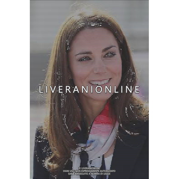 LONDON, ENGLAND - MARCH 15: Catherine, Duchess of Cambridge smiles as she wears the Team GB Official Supporter\'s Scarf for London 2012 before meeting the GB HockeyTeam at the Riverside Arena in the Olympic Park on March 15, 2012 in London, England. The Duchess of Cambridge viewed the Olympic park as well as meeting members of the men\'s and women\'s GB Hockey teams. ©photoshot/AGENZIA ALDO LIVERANI SAS - ITALY ONLY - REALI INGLESI: Kate Middleton, duchessa di Cambridge in visita al Parco Olimpico presso l\'Arena Riverside per incontrare i membri degli uomini e donne della squadra di hockey inglese - Londra, Inghilterra - 15 marzo 2012