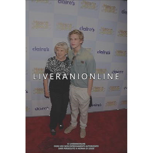 HOLLYWOOD, CA - MARCH 17: Cody Simpson and Grandmother arrive at the \'Mirror Mirror\' Los Angeles Premiere at Grauman\'s Chinese Theatre on March 17, 2012 in Hollywood, California. /photoshot/ag aldo liverani/italy only