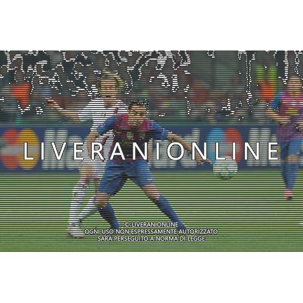 UEFA Champions League - Quarti di finale gara di andata Milano 28-03-2012 Milan - Barcellona nella foto: massimo Ambrosini e Xavi foto Roberto Garavaglia - ag. Aldo Liverani sas