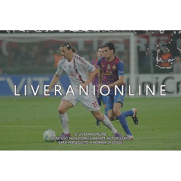 UEFA Champions League - Quarti di finale gara di andata Milano 28-03-2012 Milan - Barcellona nella foto: zlatan Ibrahimovic e Busquets foto Roberto Garavaglia - ag. Aldo Liverani sas