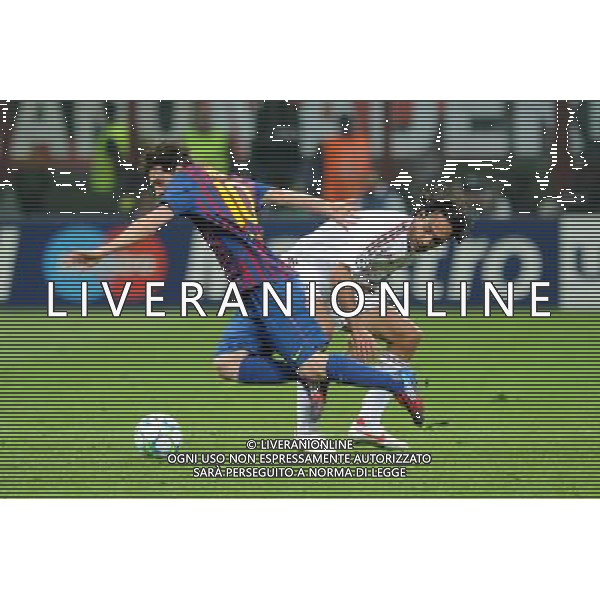 UEFA Champions League - Quarti di finale gara di andata Milano 28-03-2012 Milan - Barcellona nella foto: alessandro Nesta ferma lionel Messi foto Roberto Garavaglia - ag. Aldo Liverani sas