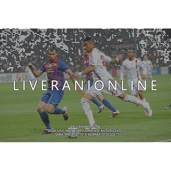 UEFA Champions League - Quarti di finale gara di andata Milano 28-03-2012 Milan - Barcellona nella foto: Kevin Prince Boateng (Milan) e sulla SX Javier Mascherano (Barcellona) foto Roberto Garavaglia - ag. Aldo Liverani sas