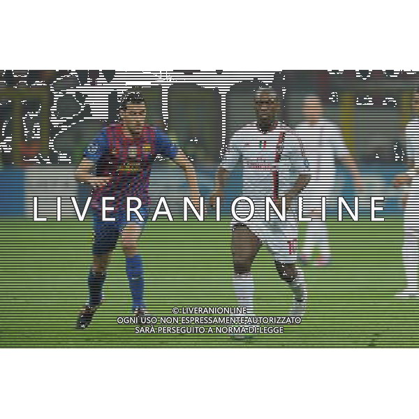 UEFA Champions League - Quarti di finale gara di andata Milano 28-03-2012 Milan - Barcellona nella foto: Clarence Seedorf (Milan) e sulla SX Sergio Busquets (Barcellona) foto Roberto Garavaglia - ag. Aldo Liverani sas