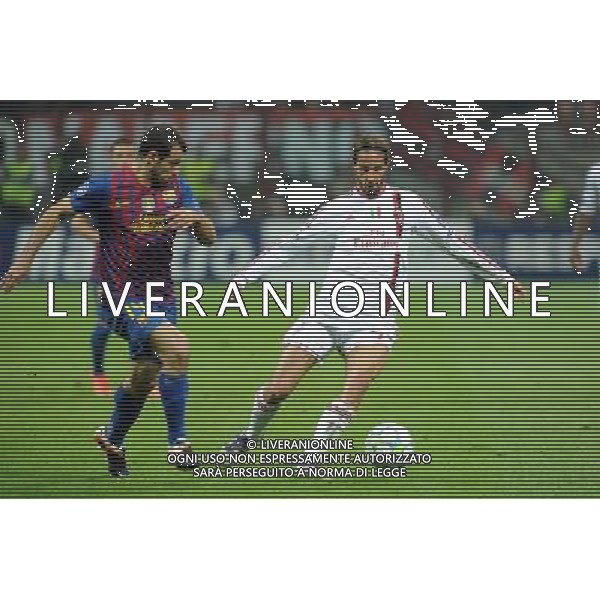 UEFA Champions League - Quarti di finale gara di andata Milano 28-03-2012 Milan - Barcellona nella foto: Luca Antonini (Milan) e sulla SX Javier Mascherano (Barcellona) foto Roberto Garavaglia - ag. Aldo Liverani sas