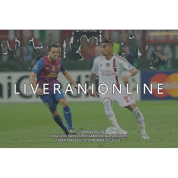 UEFA Champions League - Quarti di finale gara di andata Milano 28-03-2012 Milan - Barcellona nella foto: Kevin Prince Boateng (Milan) e sulla SX Xavi Hernandez (Barcellona) foto Roberto Garavaglia - ag. Aldo Liverani sas
