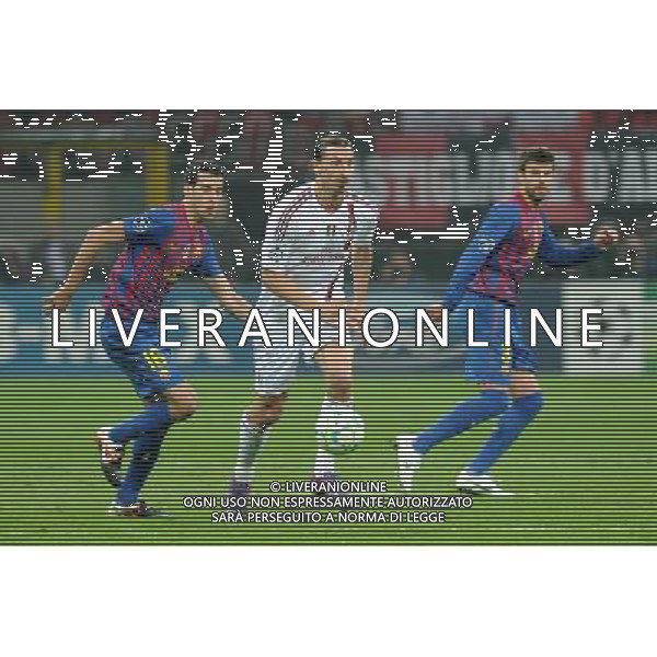UEFA Champions League - Quarti di finale gara di andata Milano 28-03-2012 Milan - Barcellona nella foto: Zlatan Ibrahimovic (Milan) tra Sergio Busquets (Barcellona) a SX e Gerad PiquŽ (Barcellona) a DX foto Roberto Garavaglia - ag. Aldo Liverani sas