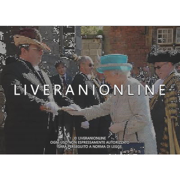 Queen Elizabeth II touches the Sigismund sword held by sword bearer Dean Leighton-Eshelby as she arrives at Micklegate Bar, York, ahead of the Royal Maundy Service at York Minster for the Royal Maundy service. ©PHOTOSHOT/AG ALDOLIVERANI SAS - ITALY ONLY -