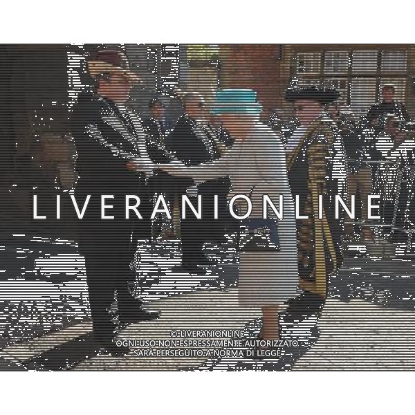 Queen Elizabeth II touches the Sigismund sword held by sword bearer Dean Leighton-Eshelby as she arrives at Micklegate Bar, York, ahead of the Royal Maundy Service at York Minster for the Royal Maundy service. ©PHOTOSHOT/AG ALDOLIVERANI SAS - ITALY ONLY -