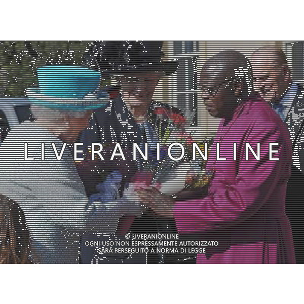 The Archbishop of York, Dr John Sentamu, takes flowers from Queen Elizabeth II after she received them from local children outside the Yorkshire Museum after the Royal Maundy Service held in York Minster. ©photoshot/AGENZIA ALDO LIVERANI SAS - ITALY ONLY - REALI INGLESI: La regina Elisabetta II d\'inghilterra durante una visita al Museo Yorkshire
