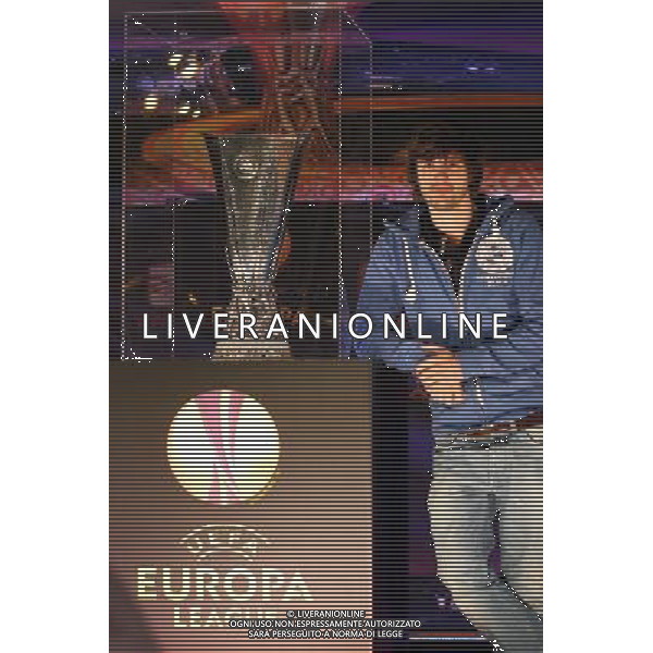 (120412) -- BUCHAREST, April 12, 2012 () -- A local citizen poses for pictures with UEFA European League trophy in Bucharest, capital of Romania, April 11, 2012. The famous silverware will visit ten locations until May 9, 2012, when the 2012 UEFA European League final is played in Bucharest. (/Gabriel Petrescu) /PHOTOSHOT/ALDO LIVERANI ITALY ONLY
