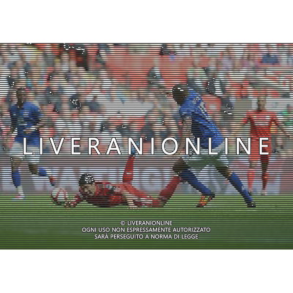 Liverpool\'s Luis Suarez falls after a challenge from Everton\'s Sylvain Distin Football - FA Challenge Cup Semi Final - Liverpool v Everton - Saturday 14th April 2012 - Wembley - London å© CameraSport - 43 Linden Ave. Countesthorpe. Leicester. England. LE8 5PG - Tel: +44 (0) 116 277 4147 - admin@camerasport.com - www.camerasport.com AG ALDO LIVERANI S A S ONLY ITALY