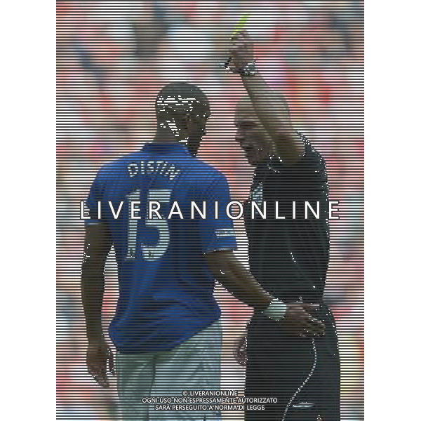 Referee Howard Webb shows the yellow card to Everton\'s Sylvain Distin Football - FA Challenge Cup Semi Final - Liverpool v Everton - Saturday 14th April 2012 - Wembley - London å© CameraSport - 43 Linden Ave. Countesthorpe. Leicester. England. LE8 5PG - Tel: +44 (0) 116 277 4147 - admin@camerasport.com - www.camerasport.com AG ALDO LIVERANI S A S ONLY ITALY
