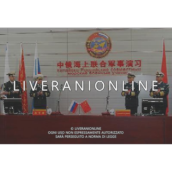 (120422) -- QINGDAO, April 22, 2012 () -- Ding Yiping (2nd L), deputy commander of the Navy of the Chinese People\'s Liberation Army, and Rear Admiral Leonid Sukhanov (2nd R), Russian naval deputy chief of staff, attend the starting ceremony of the Russia-China joint naval exercise in Qingdao, east China\'s Shandong Province, April 22, 2012. The Russia-China joint naval exercise, scheduled to be held from April 22 to 27 in the Yellow Sea of the Pacific Ocean, officially started on Sunday morning. The drill involves a total of 16 vessels and two submarines from the Chinese Navy and four warships from the Russian Navy\'s Pacific Fleet as well as three supply ships. The exercise will focus on joint maritime air defense and defense of marine traffic arteries, including subjects of joint escort, maritime search and rescue, anti-submarine tactics as well as joint effort to rescue hijacked vessels. (/Zha Chunming) (lfj) ©photoshot/AG ALDO LIVERANI SAS - ITALY ONLY -