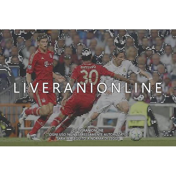 Real Madrid\'s Angel di Maria and Bayern Munich\'s Luiz Gustavo and Mario Gomez during Champions League match on april 25th 2012. Photo: Cesar Cebolla / ALFAQUI