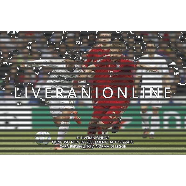 Real Madrid\'s Mesut Ozil and Bayern Munich\'s Holger Badstuber during Champions League match on april 25th 2012. Photo: Cesar Cebolla / ALFAQUI
