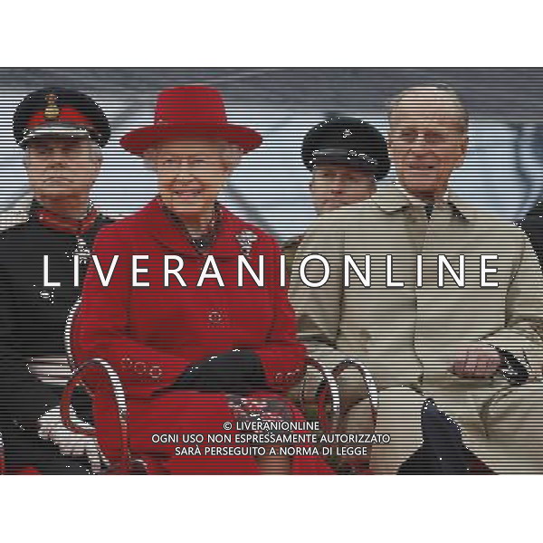 Britain\'s Queen Elizabeth II and The Duke of Edinburgh watch a presentation during a visit to the Cutty Sark in Greenwich, London, Wednesday, April 25, 2012. The Cutty Sark, built in 1869 was one of the last and one of the fastest tea clippers to be built. The Cutty Sark was badly damaged by fire on in May 2007 but after a 50 million pounds ($80.6 million) restoration project the vessel is restored and will reopen to the public on April 26, 2012 ©photoshot/AGENZIA ALDO LIVERANI SAS - ITALY ONLY - REALI INGLESI: Sua Maesta\' la Regina Elisabetta II d\'inghilterra in visita al Museo Nazionale della Marina